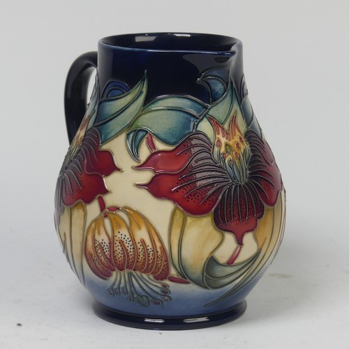 119 - A Moorcroft Pottery ‘Anna Lily’ pattern Jug, by Nicola Slaney, 20th century, marks to base, 15cm hig... 