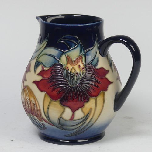 119 - A Moorcroft Pottery ‘Anna Lily’ pattern Jug, by Nicola Slaney, 20th century, marks to base, 15cm hig... 