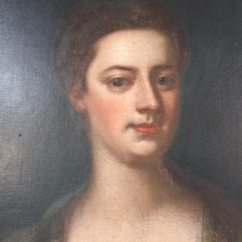331 - Circle of Michael Dahl (Swedish 1656-1743), Portrait of a Lady, three-quarter length, in a red dress... 