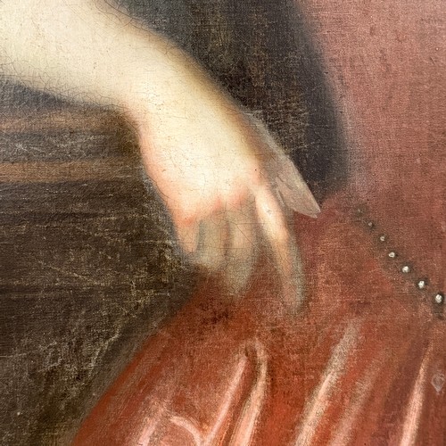 331 - Circle of Michael Dahl (Swedish 1656-1743), Portrait of a Lady, three-quarter length, in a red dress... 