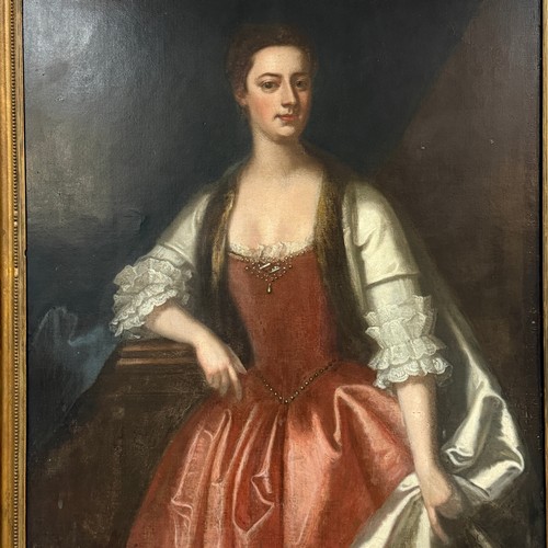 331 - Circle of Michael Dahl (Swedish 1656-1743), Portrait of a Lady, three-quarter length, in a red dress... 