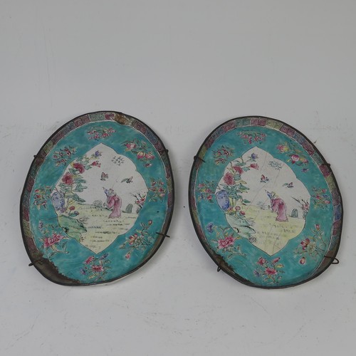16 - A pair of Chinese Canton enamel-on-copper famille rose oval Dishes, 19th century, iron red four char... 