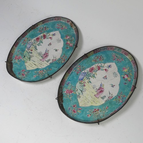 16 - A pair of Chinese Canton enamel-on-copper famille rose oval Dishes, 19th century, iron red four char... 