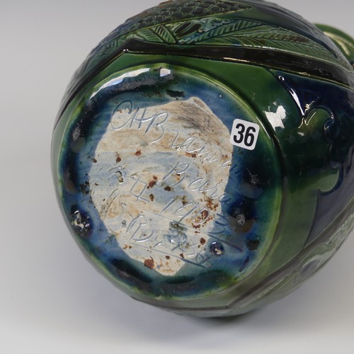 64 - A C.H. Brannam Pottery two-handled Vase, dated 1903, decorated in coloured enamels, with fish motif ... 