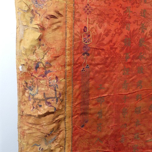 15 - Chinese textiles: a Qing Dynasty embroidered silk brocade wall hanging, the central panel in red bro... 