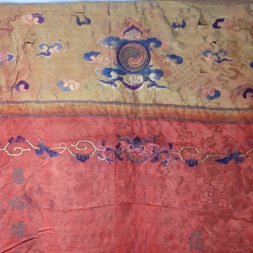 15 - Chinese textiles: a Qing Dynasty embroidered silk brocade wall hanging, the central panel in red bro... 