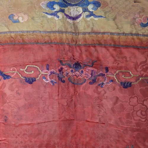 15 - Chinese textiles: a Qing Dynasty embroidered silk brocade wall hanging, the central panel in red bro... 