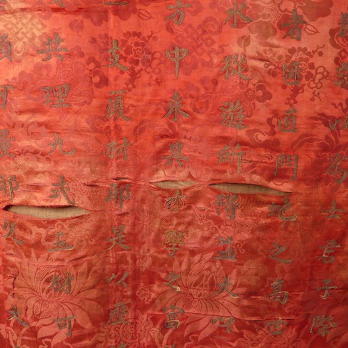 15 - Chinese textiles: a Qing Dynasty embroidered silk brocade wall hanging, the central panel in red bro... 