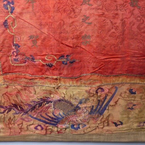 15 - Chinese textiles: a Qing Dynasty embroidered silk brocade wall hanging, the central panel in red bro... 