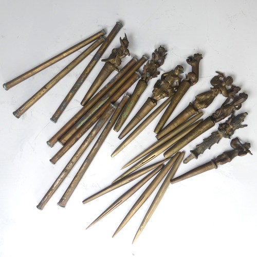 49 - A collection of eight bronze Burmese tattoo carved counterweights and needles, circa 19th century, i... 