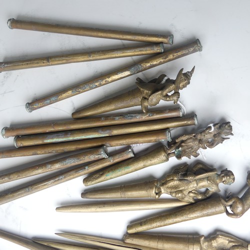 49 - A collection of eight bronze Burmese tattoo carved counterweights and needles, circa 19th century, i... 