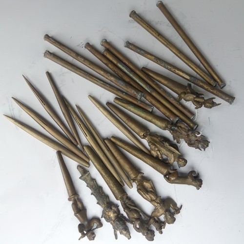49 - A collection of eight bronze Burmese tattoo carved counterweights and needles, circa 19th century, i... 