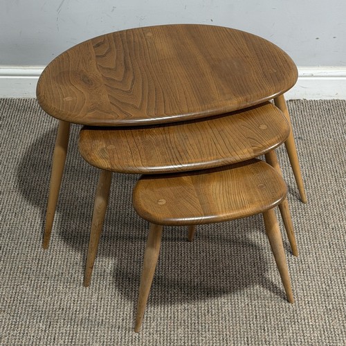 1 - An Ercol elm and beech nest of three 'Pebble' Tables, no.354, 1960s, (Largest) W 65 cm x H 40 cm x D... 