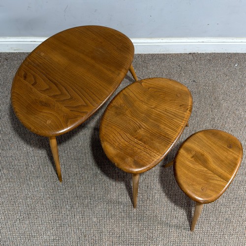 1 - An Ercol elm and beech nest of three 'Pebble' Tables, no.354, 1960s, (Largest) W 65 cm x H 40 cm x D... 
