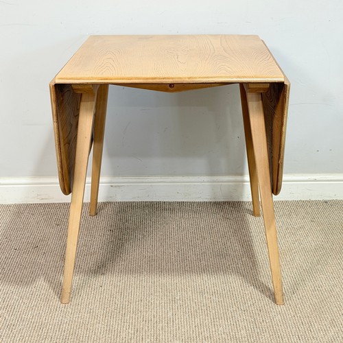3 - An Ercol light elm and beech drop-leaf dining Table, No.383, W 137 cm x H 70 cm x D 75 cm.... 