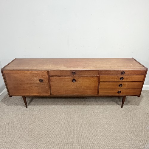 6 - A mid-20th century teak retro Sideboard, possibly designed by Robert Heritage, with central cutlery ... 