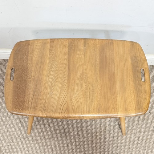 15 - An Ercol elm and beech 'Butlers Tray' coffee Table, No.457, with galleried under-tier raised on tape... 