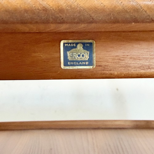 15 - An Ercol elm and beech 'Butlers Tray' coffee Table, No.457, with galleried under-tier raised on tape... 