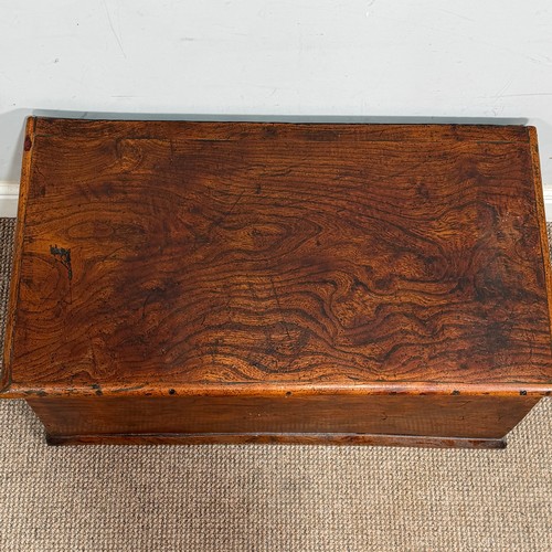 34 - An early 20th century elm Trunk, of small proportions, with gilt-metal carrying handles to either si... 