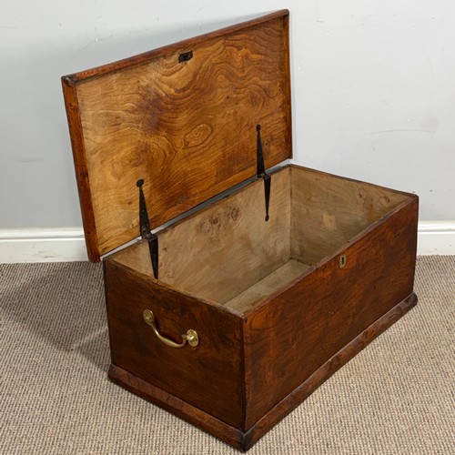 34 - An early 20th century elm Trunk, of small proportions, with gilt-metal carrying handles to either si... 