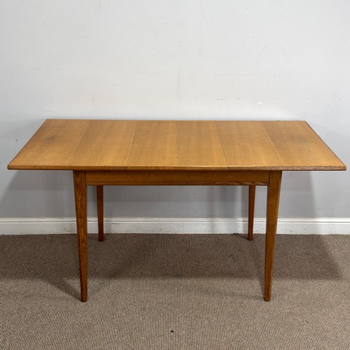 14 - A Gordon Russell oak extending dining Table, retailed by Heals of London, raised on tapering support... 