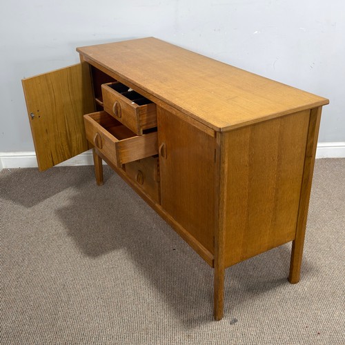 13 - A mid-20th century Cotswold School light oak Sideboard, by Heals of London, the central drop of four... 