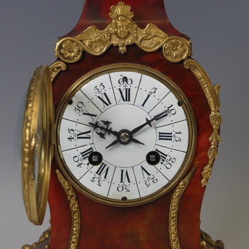 39 - A late 19th century Boulle type mantle Clock, the circular white dial applied with Roman numeral hou... 