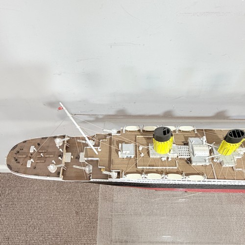 51 - A scratch built wooden and painted Model of the RMS Titanic, displayed on a wooden plinth, L 105 cm,... 