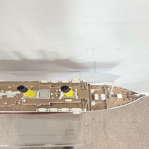 51 - A scratch built wooden and painted Model of the RMS Titanic, displayed on a wooden plinth, L 105 cm,... 