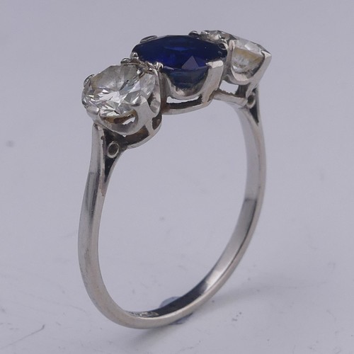 262 - A sapphire and diamond three stone Ring, the central oval facetted sapphire approx. 1.39ct (6.86mm d... 