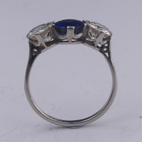 262 - A sapphire and diamond three stone Ring, the central oval facetted sapphire approx. 1.39ct (6.86mm d... 
