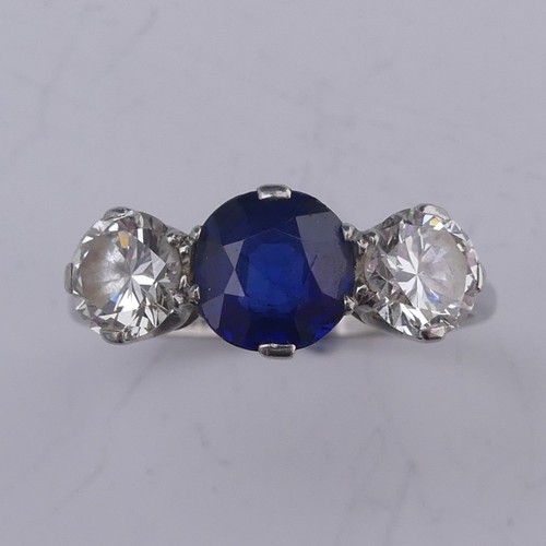 262 - A sapphire and diamond three stone Ring, the central oval facetted sapphire approx. 1.39ct (6.86mm d... 