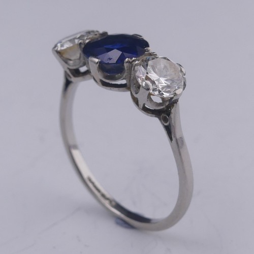 262 - A sapphire and diamond three stone Ring, the central oval facetted sapphire approx. 1.39ct (6.86mm d... 