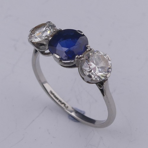262 - A sapphire and diamond three stone Ring, the central oval facetted sapphire approx. 1.39ct (6.86mm d... 