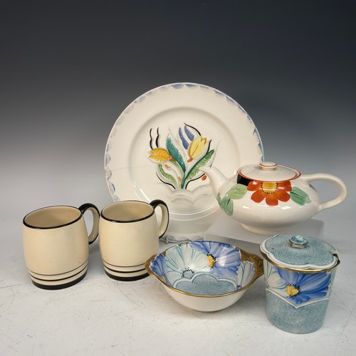 A Susie Cooper for Grays Pottery ‘Tulip’ pattern plate, printed mark to base, no. ‘8037’, losses and cracks to rim, 25cm diameter, together with a collection of Grays Pottery ‘Floral’ pattern wares, to include two Teapots, printed marks to base, 8.5cm high, four Jugs, the tallest 17.5cm high, a handled Dish and lidded Jam Pot, and a small milk jug, painted with spider web pattern. (10)