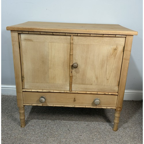 An antique pine and faux bamboo Cupboard, of small proportions, in the Regency style, with later additions, applied with and raised on simulated bamboo, W 78.5 cm x H 75 cm x D 45 cm.