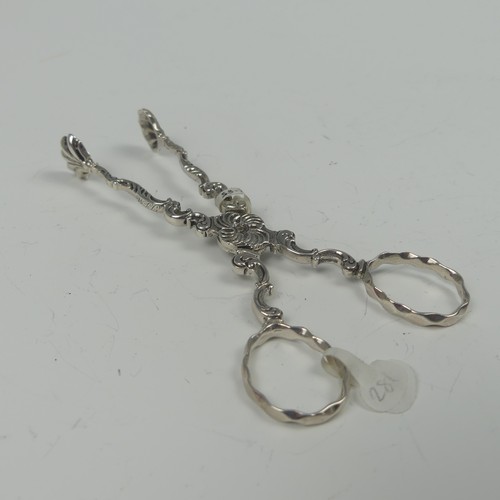 20 - A pair of mid-18thC silver scissor action Sugar Tongs, marked twice with makers mark a crowned GH, p... 