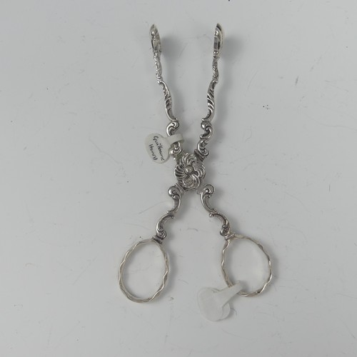 20 - A pair of mid-18thC silver scissor action Sugar Tongs, marked twice with makers mark a crowned GH, p... 