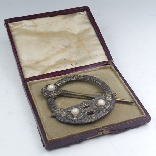 444 - A mid-19thC Irish Tara Brooch, of traditional form set three half pearls, the reverse marked for 'We... 