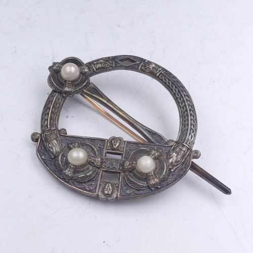 444 - A mid-19thC Irish Tara Brooch, of traditional form set three half pearls, the reverse marked for 'We... 