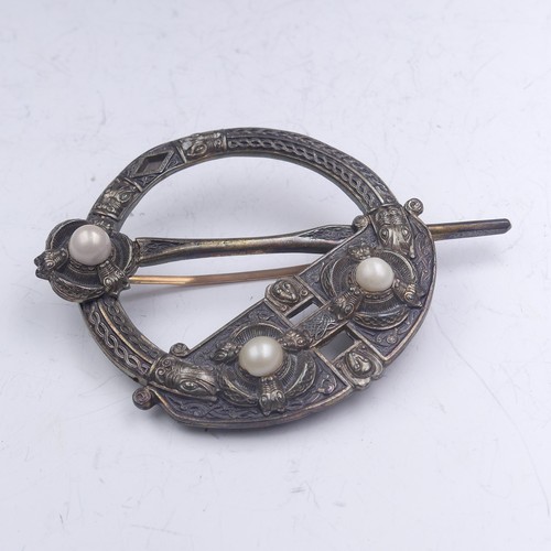 444 - A mid-19thC Irish Tara Brooch, of traditional form set three half pearls, the reverse marked for 'We... 