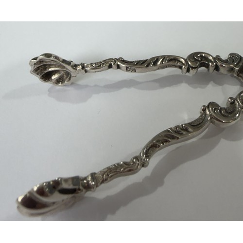 20 - A pair of mid-18thC silver scissor action Sugar Tongs, marked twice with makers mark a crowned GH, p... 