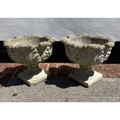 A pair of reconstituted stone garden Urns / Planters, W 42 cm x H 50 cm x D 42 cm.