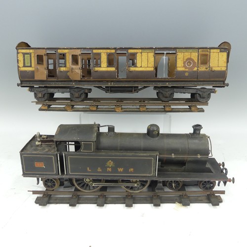 Bing for Bassett-Lowke, Gauge 1, 4-4-2 L&NWR Tank Locomotive, No.44, black with red and white pinstriping, clockwork, with key, together with a tinplate bogie passenger carriage, lacks roof, and a quantity of track (a lot)