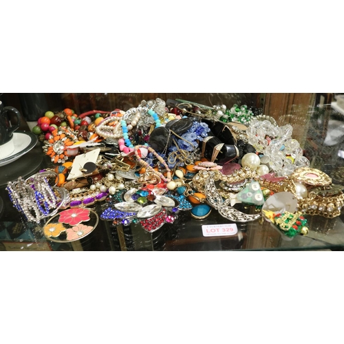 329 - LARGE SHELF OF COSTUME JEWELLERY INC. BRACELETS, EARRINGS ETC.