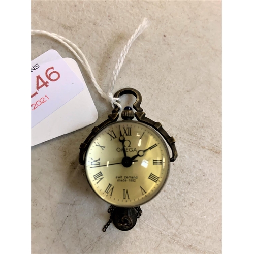 246 - SMALL CIRCULAR HANGING DESK WATCH WITH BELL MARKED OMEGA