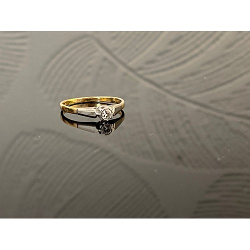 373 - 18ct. GOLD AND PLATINUM SET DIAMOND SOLITAIRE RING