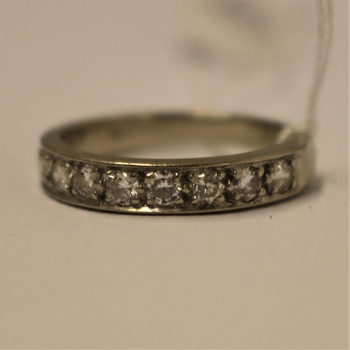 348 - 18CT WHITE GOLD AND DIAMOND HALF ETERNITY RING