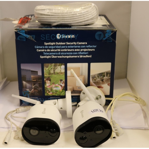 23 - BOXED SWANN SET OF 2 OUTDOOR SPOTLIGHT SECURITY CAMERAS - SHOWING SIGNS OF WEAR