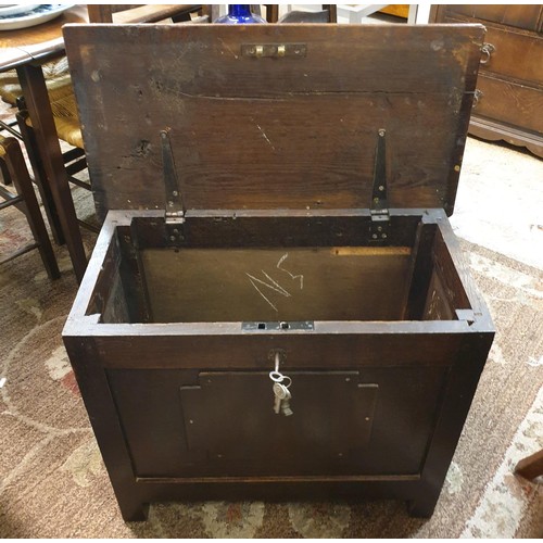 296 - A HEAVY OAK CHEST WITH LATER ADDITIONS WITH PADLOCK AND KEY